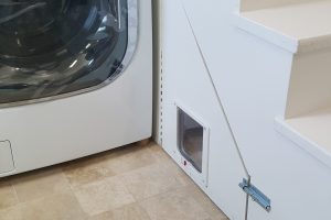 Kitty door goes under stairs and outside