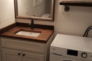 La Ventana Bathroom With Butcher Block Counters And All-In-One Washer Dryer